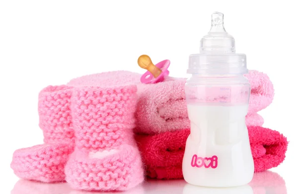 Bottle for milk with towels and nipple isolated on white — Stock Photo, Image