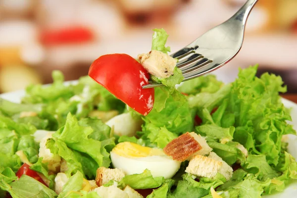 Caesar salad on white plate, close up on bright background — Stock Photo, Image