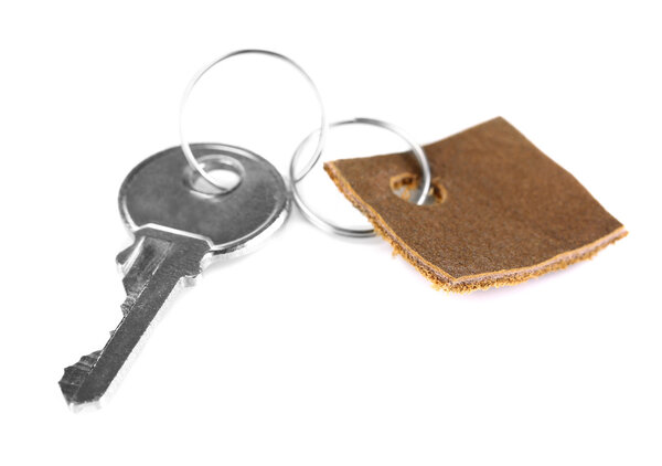 Key with leather trinket isolated on white