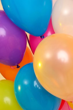 Many bright balloons close-up