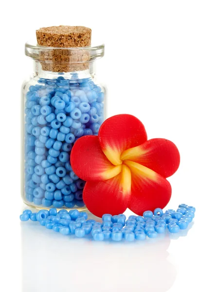 Little bottle full with colorful beads isolated on white — Stock Photo, Image