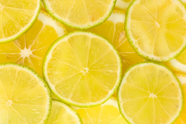 Lime e limone fette di sfondo — Foto Stock