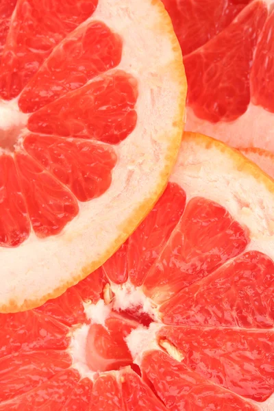 Grapefruit segmenten achtergrond — Stockfoto
