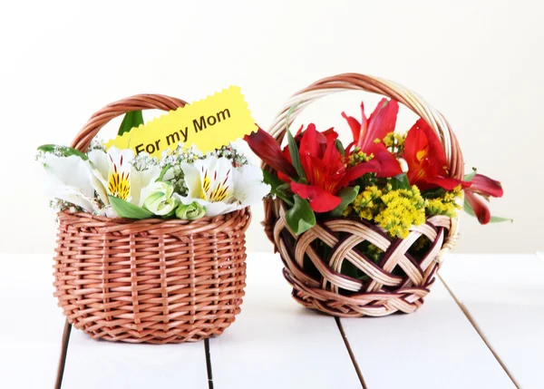 Two baskets freesia on light background — Stock Photo, Image