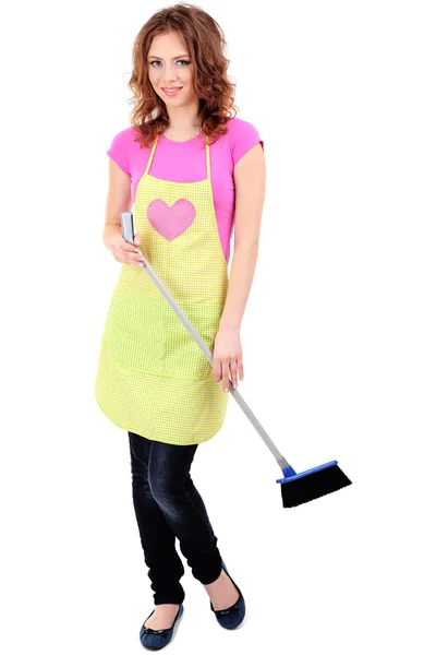 Young housewife with broom and dustpan, isolated on white — Stock Photo, Image