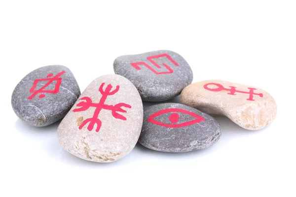 Fortune telling with symbols on stones isolated on white — Stock Photo, Image