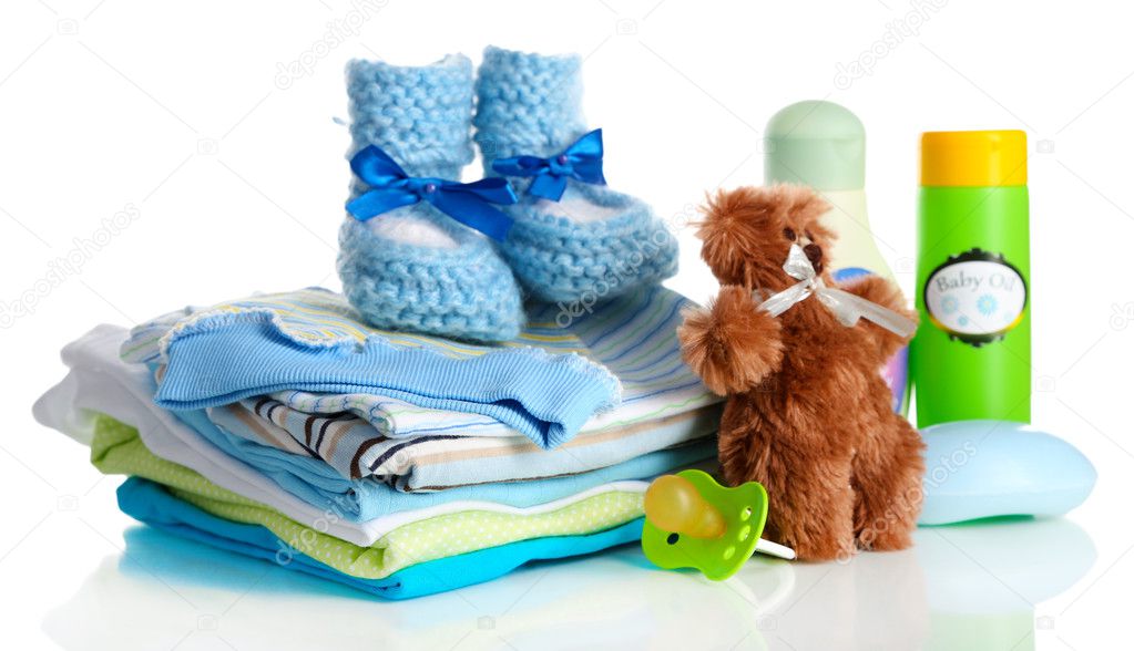 Pile of baby clothes isolated on white