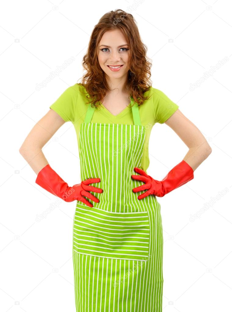 Young woman wearing green apron and rubber gloves, isolated on white