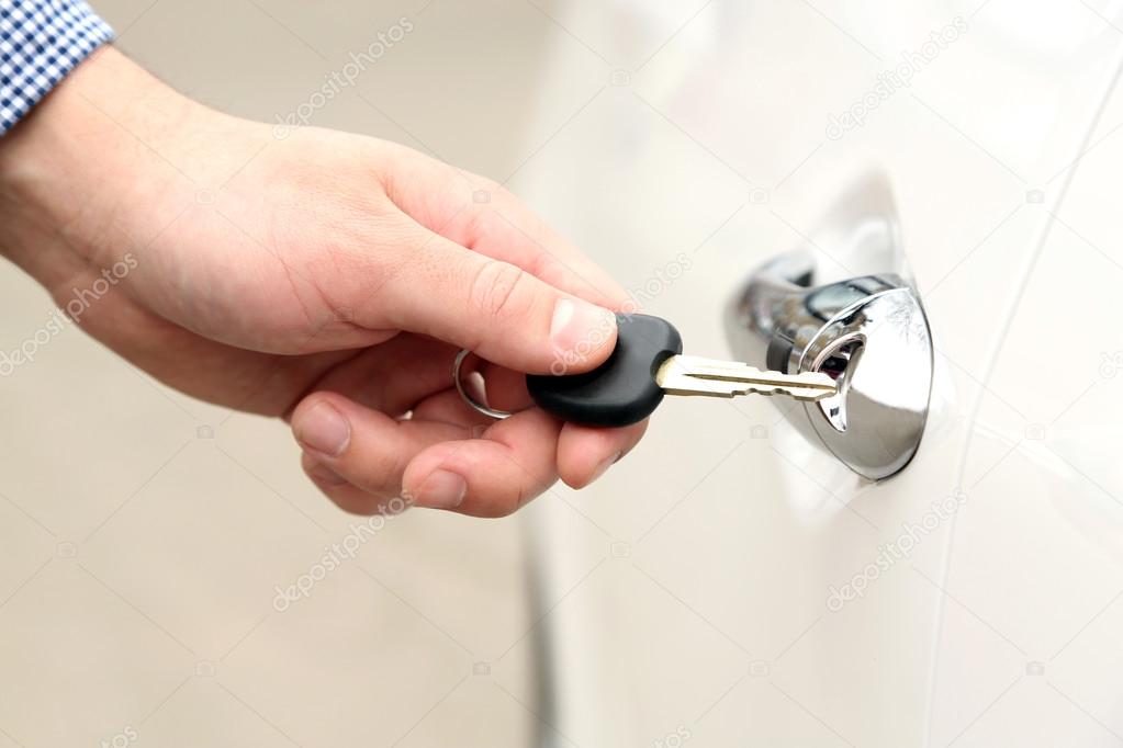 Man hand opening car door, close up