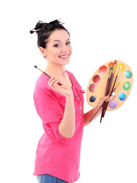 Beautiful young woman painter with brushes and palette, isolated on white — Stock Photo, Image