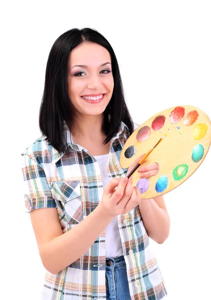 Bela jovem pintor com pincéis e paleta, isolado em branco — Fotografia de Stock