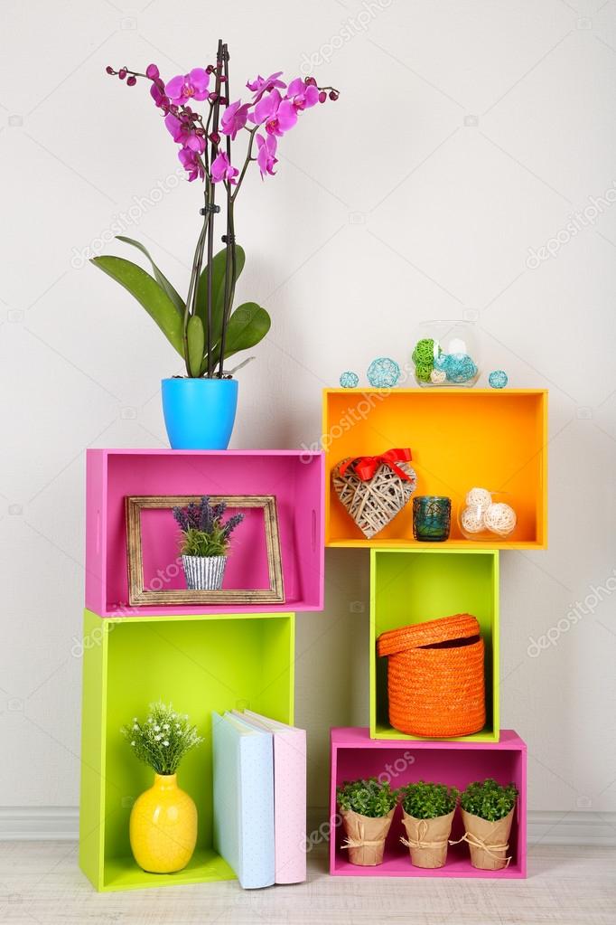 Beautiful colorful shelves with different home related objects