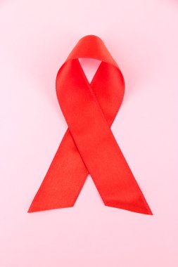 kırmızı kurdele HIV, AIDS, pembe arka plan