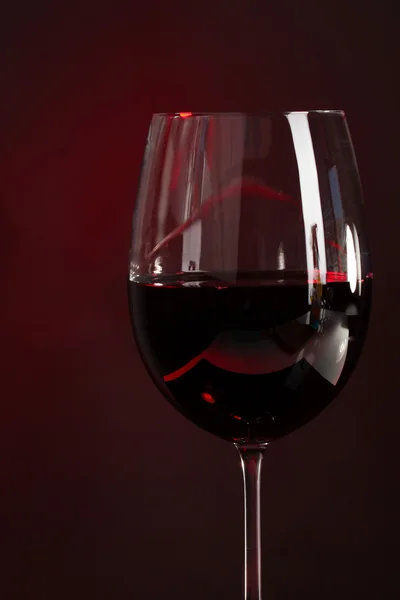 Wine in glass on dark background — Stock Photo, Image