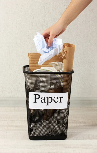 Assorted trash in bucket on room background — Stock Photo, Image