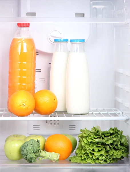 Open refrigerator with vegetarian food