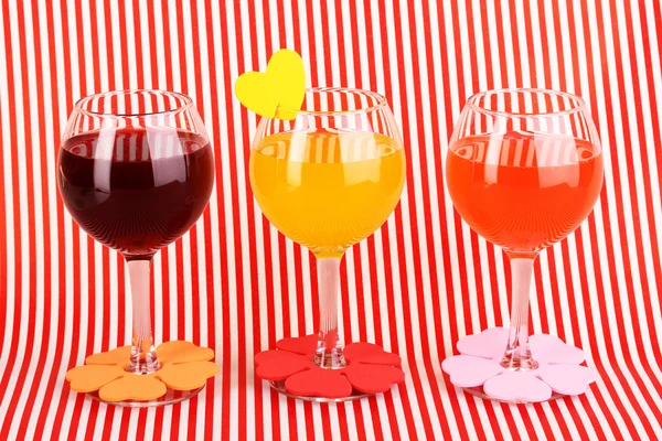 Colorful cocktails with bright decor for glasses on red background with stripes — Stock Photo, Image