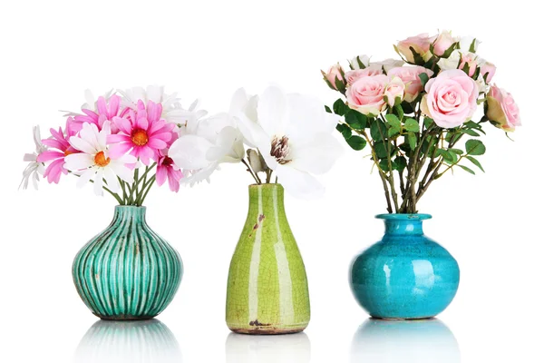 Beautiful flowers in vases isolated on white — Stock Photo, Image