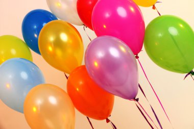 Many bright balloons close-up