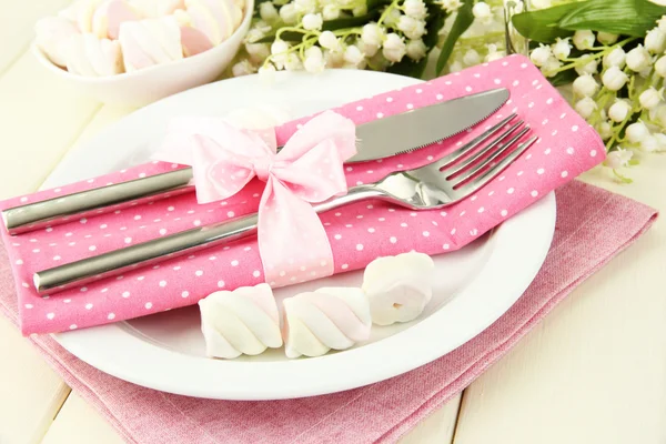 Table setting in white and pink tones on color wooden background — Stockfoto