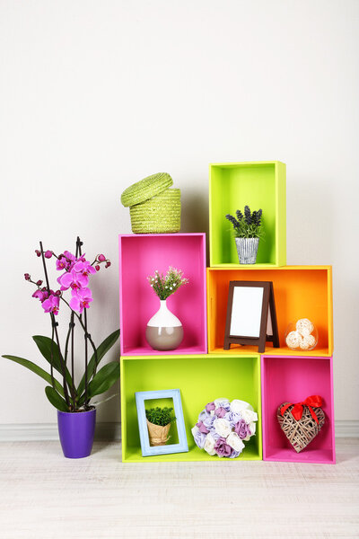 Beautiful colorful shelves with different home related objects