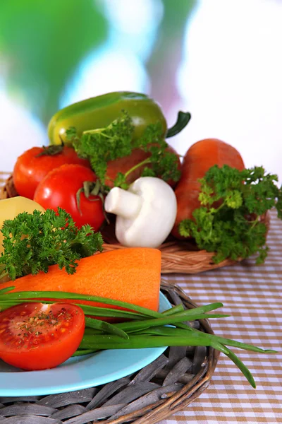 Peeled vegetables on plate on napkin — Stock Photo, Image