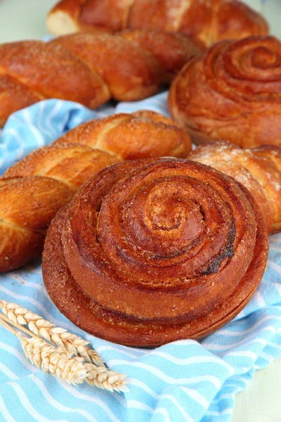 Composition with buns, on color napkin, close up — Stock Photo, Image