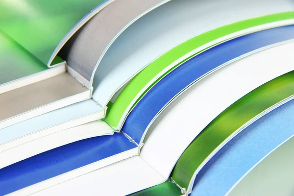 Many bright open magazines close-up — Stock Photo, Image