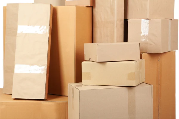 Different cardboard boxes in room — Stock Photo, Image