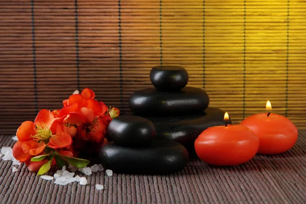 Spa stones with flowers and candles — Stock Photo, Image