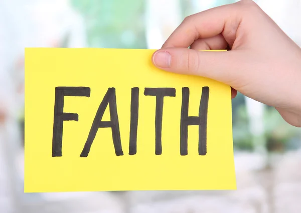 Faith word on piece paper in hand — Stock Photo, Image