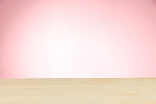 木制桌上浅粉红色背景 — 图库照片