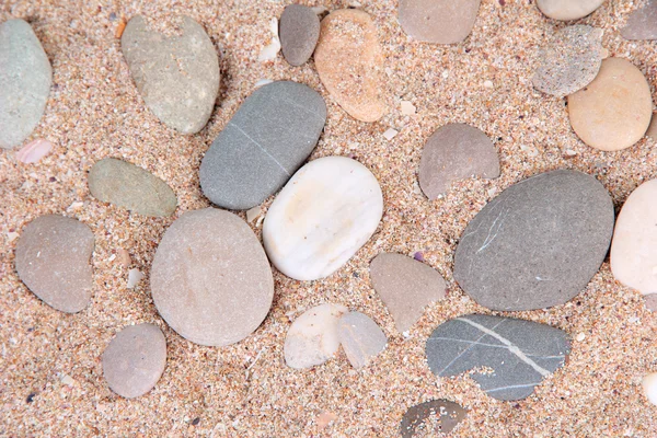 Zee stenen op zand achtergrond — Stockfoto