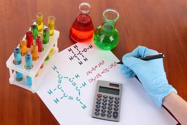Hand scientist writing formulas — Stock Photo, Image