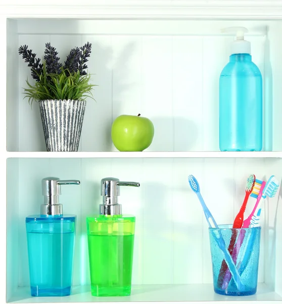 Beautiful white shelves with different home related objects — Stock Photo, Image