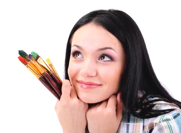 Beautiful young woman painter with brushes, isolated on white — Stock Photo, Image