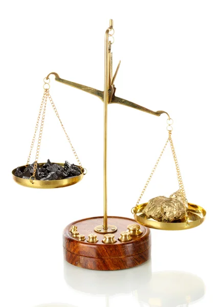 Gold and coal on scales — Stock Photo, Image