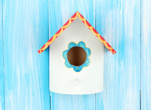 Decorative nesting box on color background — Stock Photo, Image