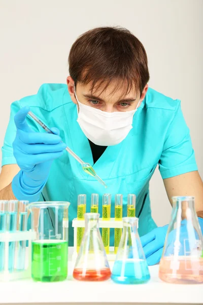 Assayer during research on room background — Stock Photo, Image