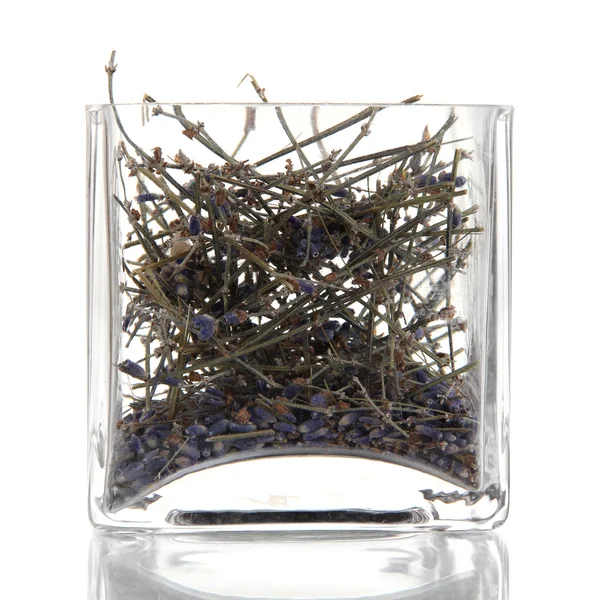 Dried herb in glass container — Stock Photo, Image