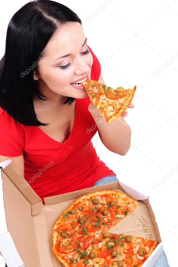 Beautiful girl eats pizza isolated on white