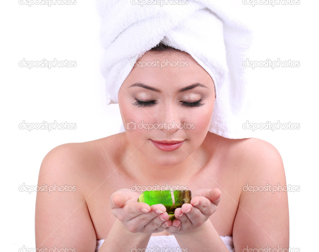 Beautiful young woman with aroma soap