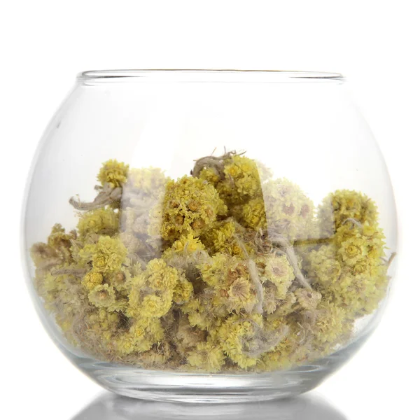 Hierba seca en recipiente de vidrio aislado en blanco — Foto de Stock