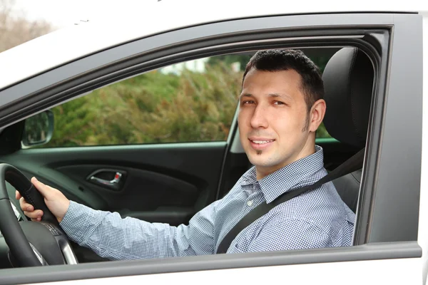 Portrait of young man sitting in the car — Stock Photo, Image