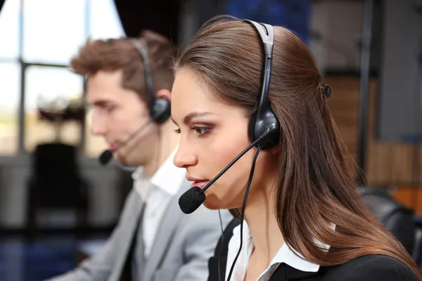 Call center operators at work — Zdjęcie stockowe