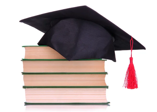 Cappello Grad con libri isolati su bianco — Foto Stock