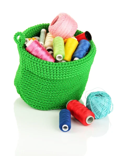 Colorful yarn for knitting in green basket isolated on white — Stock Photo, Image