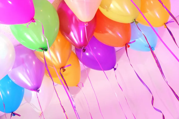 Many bright balloons under ceiling close-up — Zdjęcie stockowe