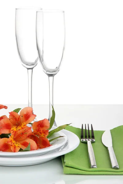 Festive table setting with flowers isolated on white — Stock Photo, Image