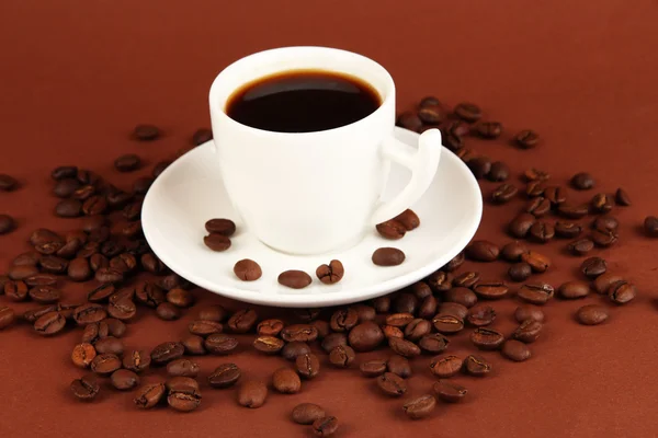 Cup of strong coffee on brown background — Stockfoto